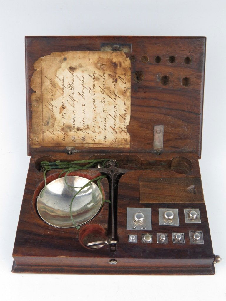 A rare Spanish diamond scale, with elegant beam, silver: A rare Spanish diamond scale, with elegant beam, silver pans and eight square silver weights, marked X1, Xs, etc. Silver tweezers with acorn knop slotted into the base, with grain weights under a slid