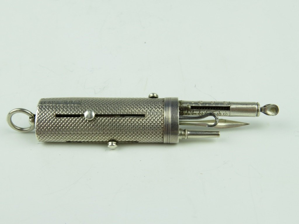 W. Vale & Sons, Birmingham 1888, a silver pocket etui,: W. Vale & Sons, Birmingham 1888, a silver pocket etui, with spring letter balance, having an engine turned oval body with propelling pencil, button hook and tooth pick, the scale with registration No.