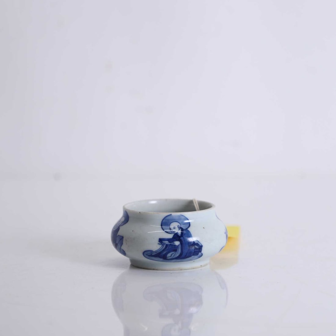 A Chinese blue and white censer,: A Chinese blue and white censer, of bombé form, the sides decorated with four seated luohan, with a six-character Jiajing mark to base 10cm diameter, 5cm high Condition Report: Pitting to the gla