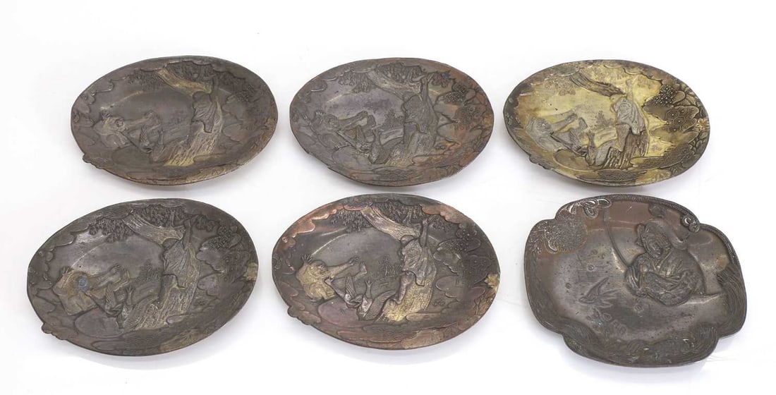A set of Japanese bronzed dishes,: A set of Japanese bronzed dishes, five depicting a scene with monkeys and a crane, and another of a lady gazing towards the sky Monkey dish, 9.4cm wide, other dish, 9cm wide 6