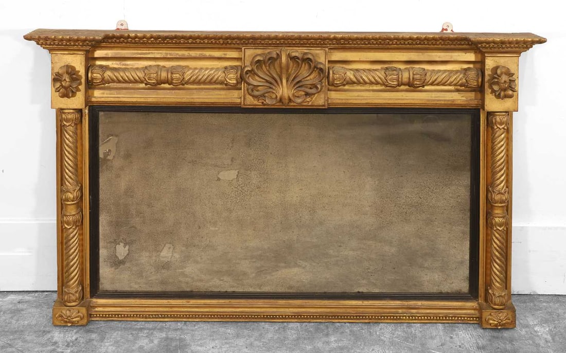 A Regency giltwood wall mirror,: A Regency giltwood wall mirror, the rectangular plate flanked and surmounted by spiral twist columns 134x78cm