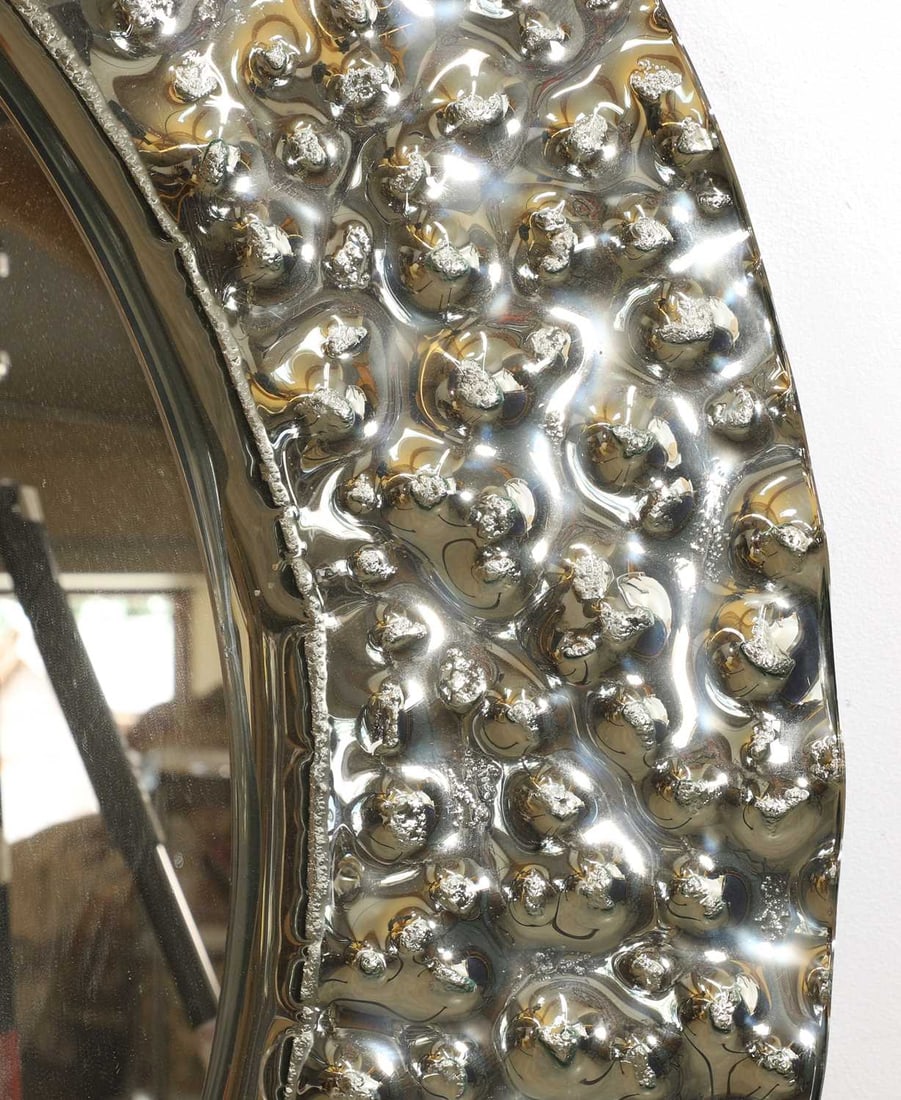 A contemporary circular wall mirror, - 2