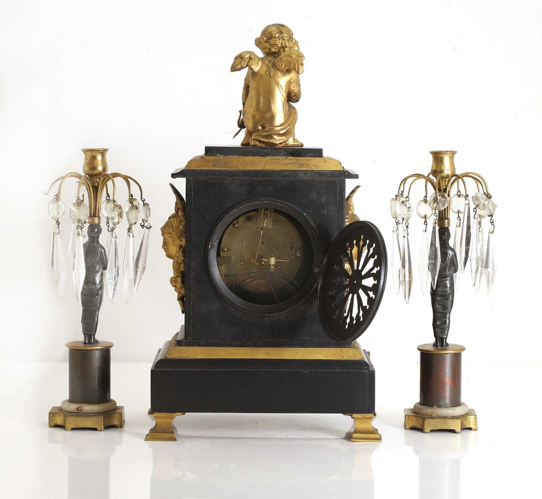 A black marble and gilt metal mantel clock, 19th century, - 2