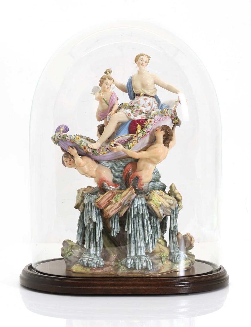 A Large Mythological Porcelain Group by Meissen, The Triumph of Venus,: A Large Mythological Porcelain Group by Meissen, The Triumph of Venus, circa1880, after a model by Johann Kaendler, depicting Venus riding the waves in a conch shell supported by Mermaids, beneath a d