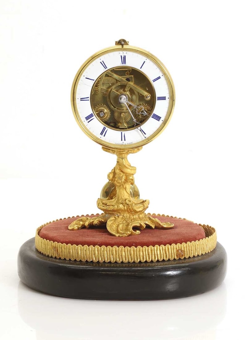 A French gilt table clock,: A French gilt table clock, with a Roman chapter ring and 8-day movement, the dial signed 'CHAUSE A PARIS', on a wooden and velvet pedestal base 19cm wide, 22cm high Condition Report: no key, with a
