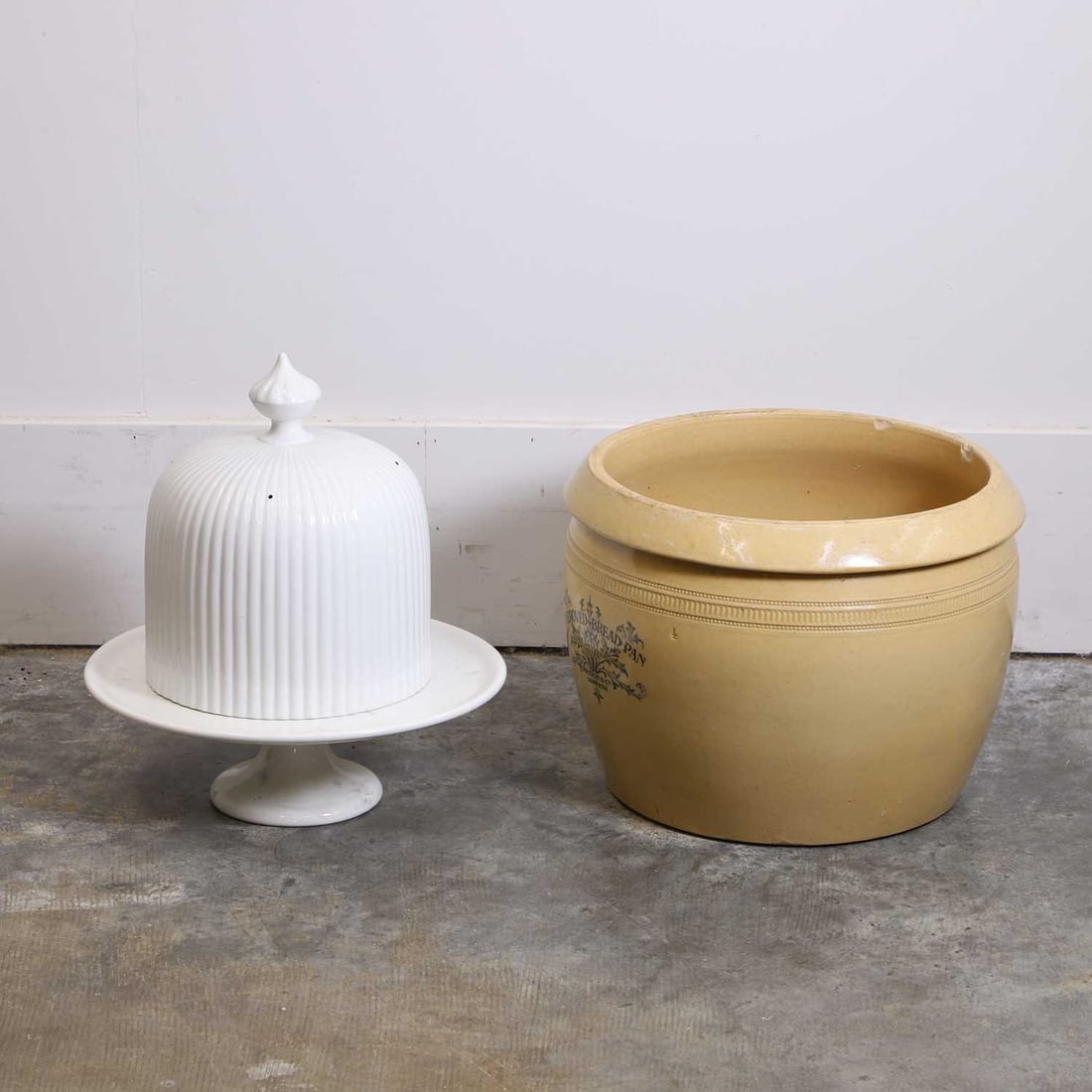 A group of French white glazed earthenware ceramics, late 19th to early 20th century,: A group of French white glazed earthenware ceramics, late 19th to early 20th century, comprising a Sarreguemines stand and matched cover, the fluted domed cover surmounted by a knop finial, raised on