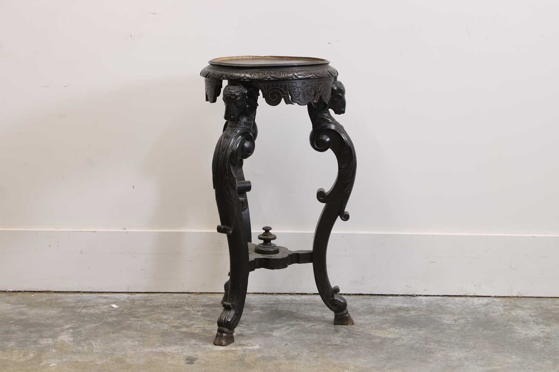 Italian wooden jardinere stand, early 20th century,: Italian wooden jardinere stand, early 20th century, with ram head terminals, united by a carved stretcher, terminating on hoofed feet 47cm diameter, 84cm high Condition Report: Some of the paint worn 
