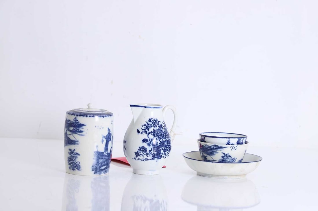 A collection of Caughley blue and white porcelain, circa 1780,: A collection of Caughley blue and white porcelain, circa 1780, comprising a tea canister and cover, in the 'Fisherman' or 'Pleasure Boat' pattern, a sparrow beak jug, in the 'Fence' pattern, underglaz
