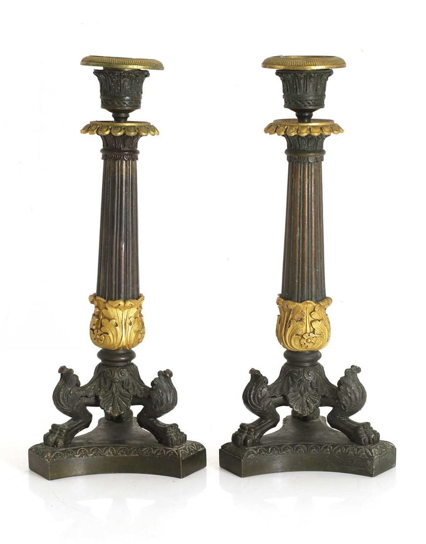 A pair of bronze and ormolu candlesticks, (1 of 2)