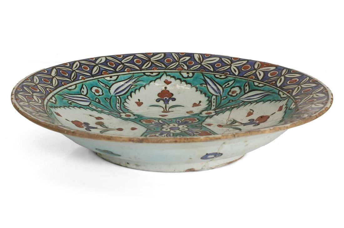 An Iznik style pottery dish, (1 of 2)
