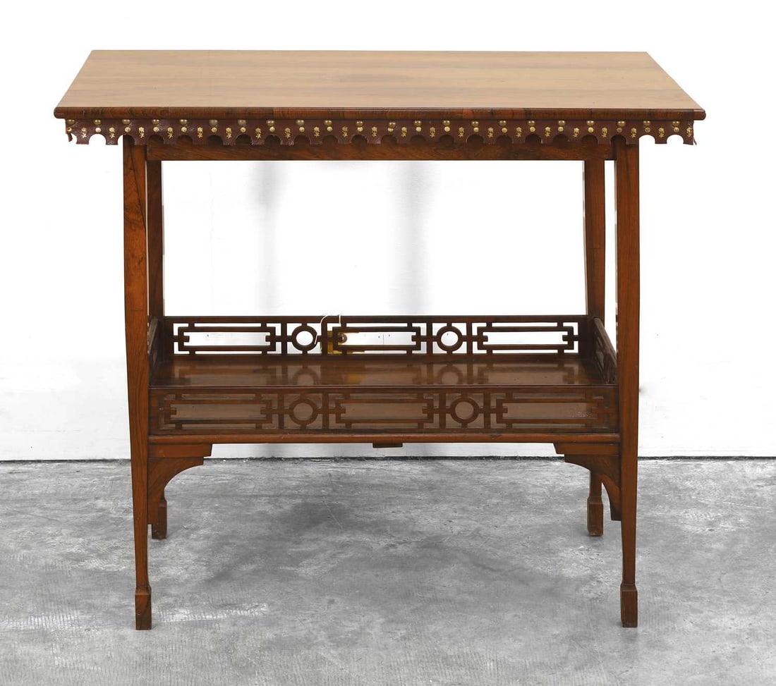 A Victorian rosewood side table, 20th century,: A Victorian rosewood side table, 20th century, the rectangular top on square tapering supports united by a galleried undertier, and leather apron 77cm wide, 46.5cm deep, 69cm high