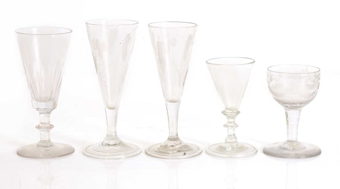 A group of five drinking glasses, late 18th century and later,: A group of five drinking glasses, late 18th century and later, comprising a near pair of ale glasses, each with engraved decoration, a later ale glass, with a facet-cut bowl, a dram glass, and a small