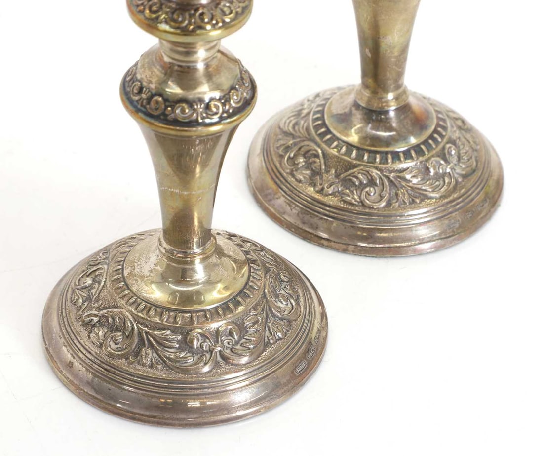 A pair of silver candlesticks, - 2