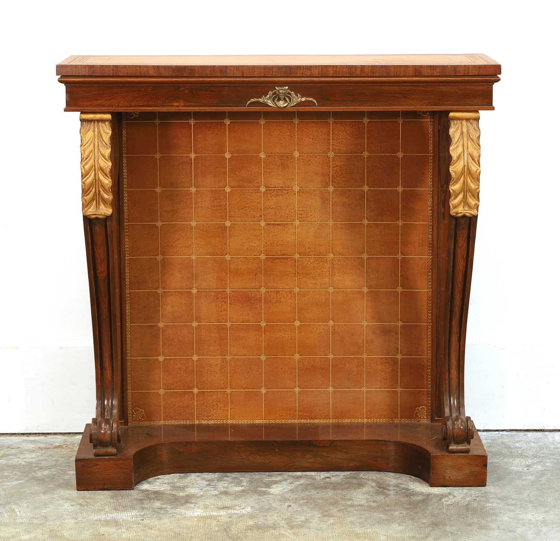 A mahogany and parcel gilt console table, 19th/20th century,: A mahogany and parcel gilt console table, 19th/20th century, the leather-lined top and back panel with leaf and paw decorated cabriole supports 91cm wide, 30.5cm deep, 90.3cm high
