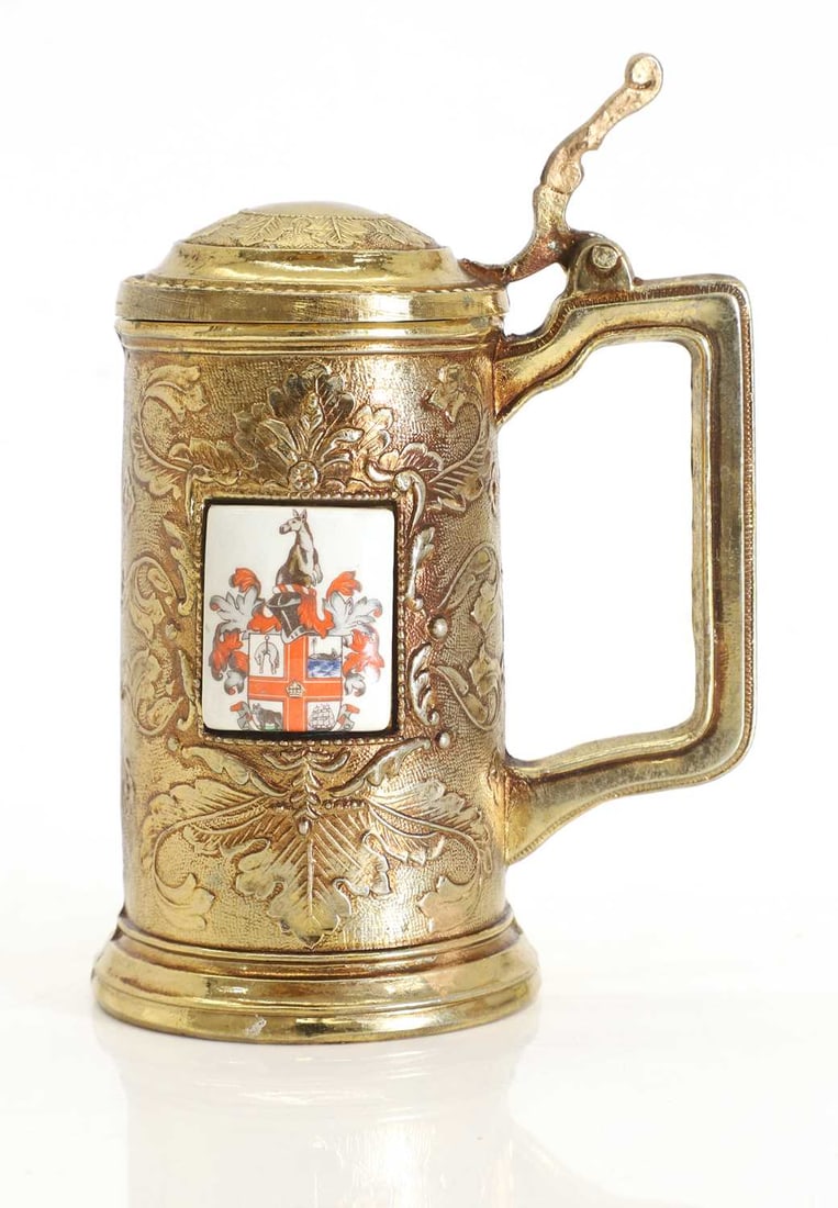 A Mauro Manetti gilt brass tankard,: A Mauro Manetti gilt brass tankard, bearing the mark of Mauro Manetti, with a porcelain plaque inset to the side 12cm wide, 16.5cm high
