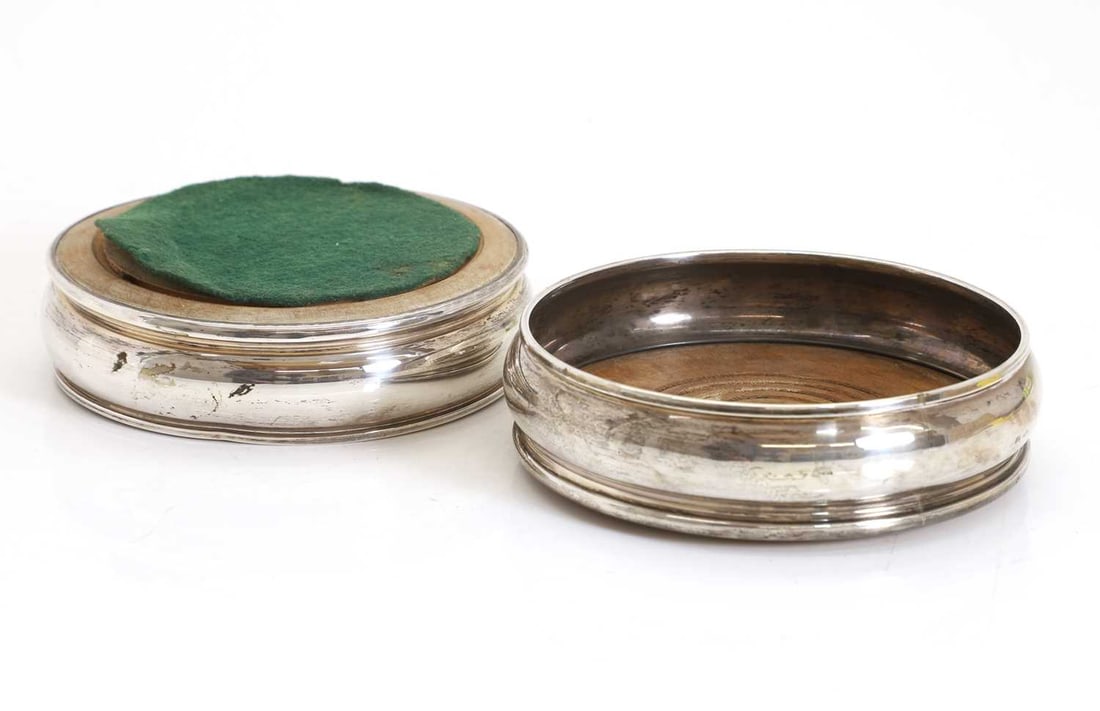 A pair of silver wine coasters, - 2