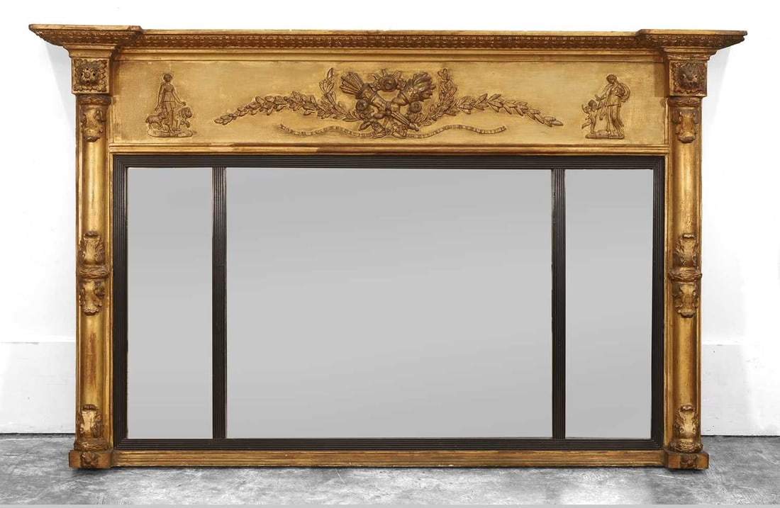 A Regency giltwood overmantel mirror, 19th century,: A Regency giltwood overmantel mirror, 19th century, the three section rectangular plate with classical relief decorated frieze flanked by pilasters 141x91cm Condition Report: Fading to the gilding