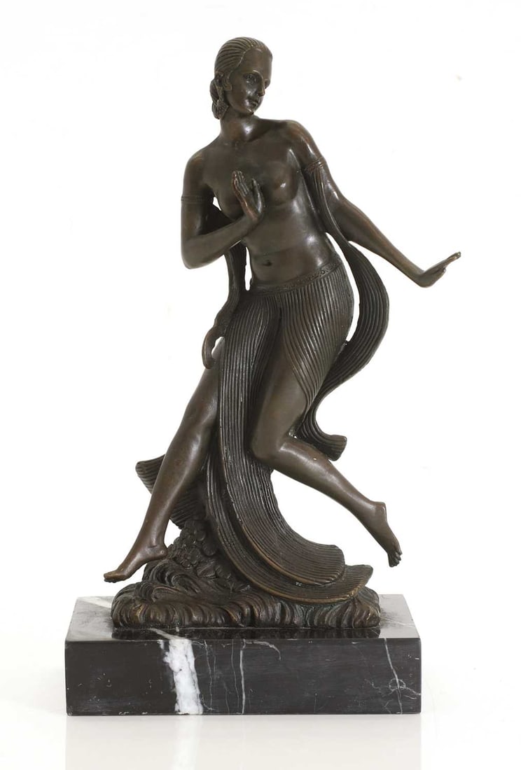 After Joe Descomps 20th century,: After Joe Descomps 20th century, bronzed figure of a nude lady dancing, with flowing skirt and armbands, signed to the back, on black veined marble base 14cm wide, 10cm deep, 27.5cm high Condition