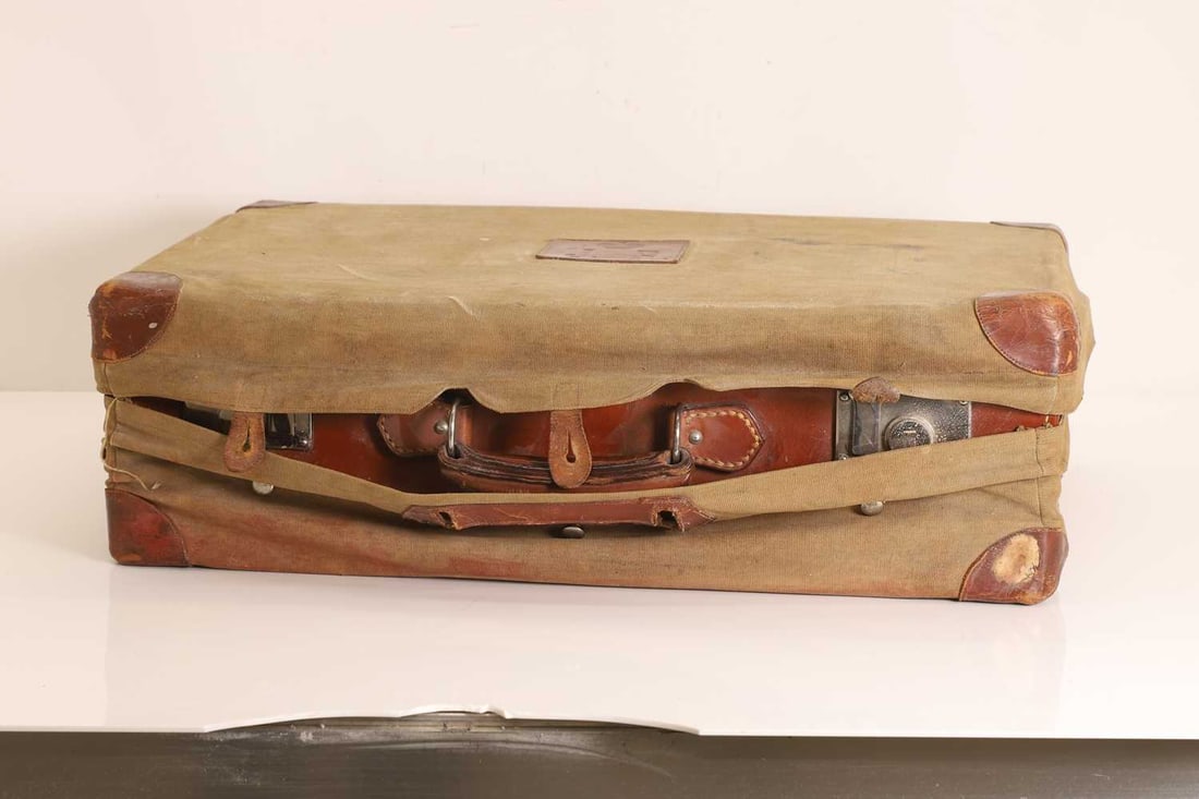 A leather vanity case with silver mounted items, - 2