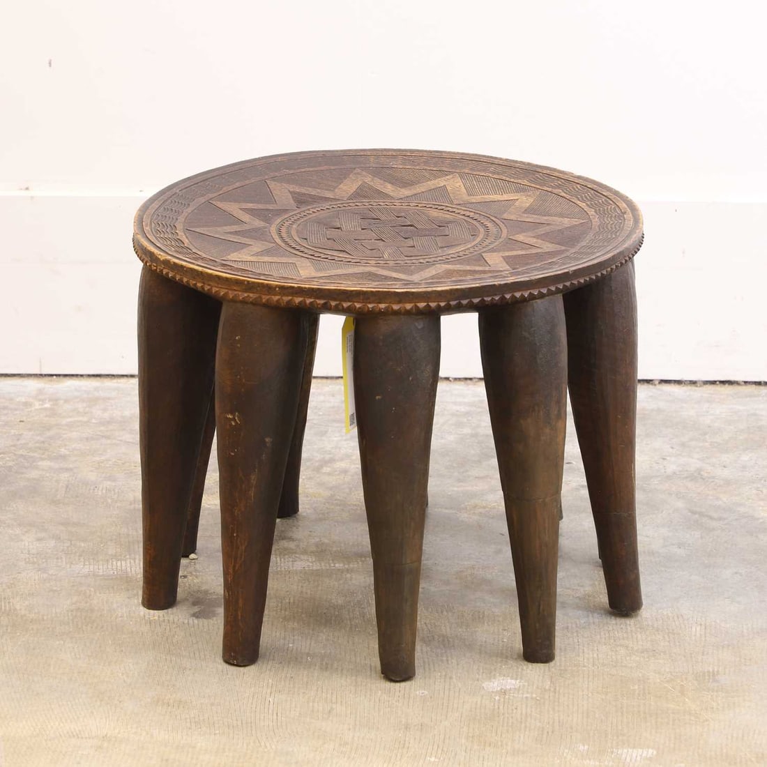 A carved hardwood Nupe stool, 20th century, Nigeria, - 2