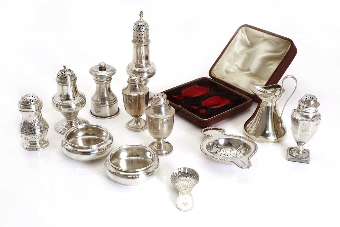 A collection of George III silver cruets,: A collection of George III silver cruets, to include a steeple caster, London, 1783, a cased pair of pepperettes by Deakin & Francis Ltd, Birmingham, 1903, with beaded decoration, three additional