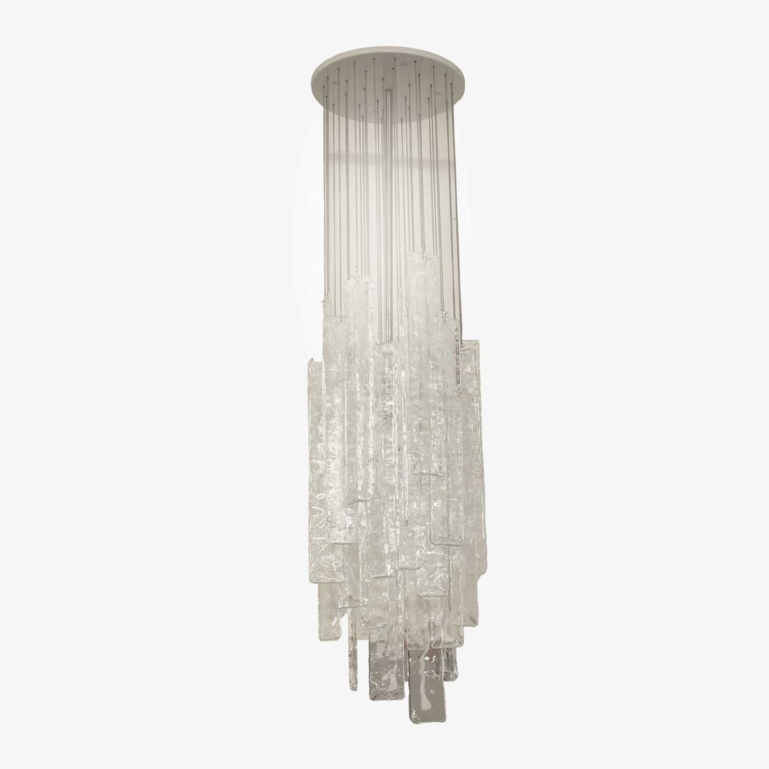 Mazzega style, a cascade chandelier,: Mazzega style, a cascade chandelier, of recent manufacture, the glass panels hanging from chains and hooks, with a central stem with a bulb, mounted to an enamelled white circular fitting 30cm wide,