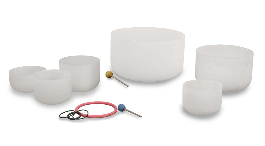 Six frosted quartz sound bath singing bowls,: Six frosted quartz sound bath singing bowls, each of plain form with straight sides, of graduated sizes, together with two rubber mallets and several O-rings largest 63cm diameter, smallest 31cm