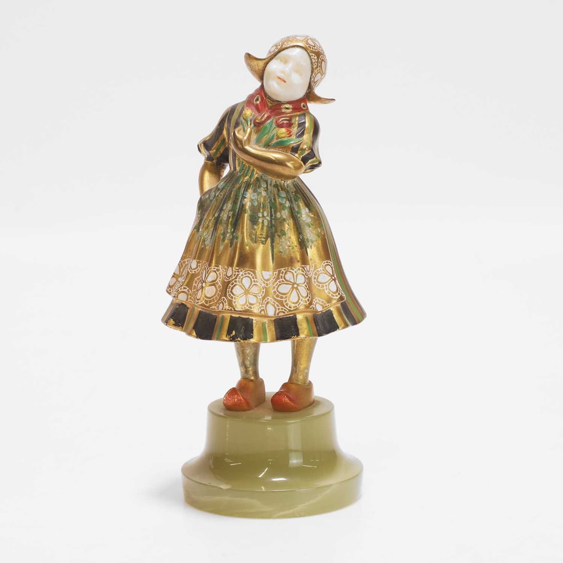 Attributed to Theodor Ullmann (Austrian, 1903-1996), a figure of a girl,: Attributed to Theodor Ullmann (Austrian, 1903-1996), a figure of a girl, circa 1915-20, bronze, polychrome painted and gilt, the head made of carved ivory and polychrome painted, mounted on an onyx ba