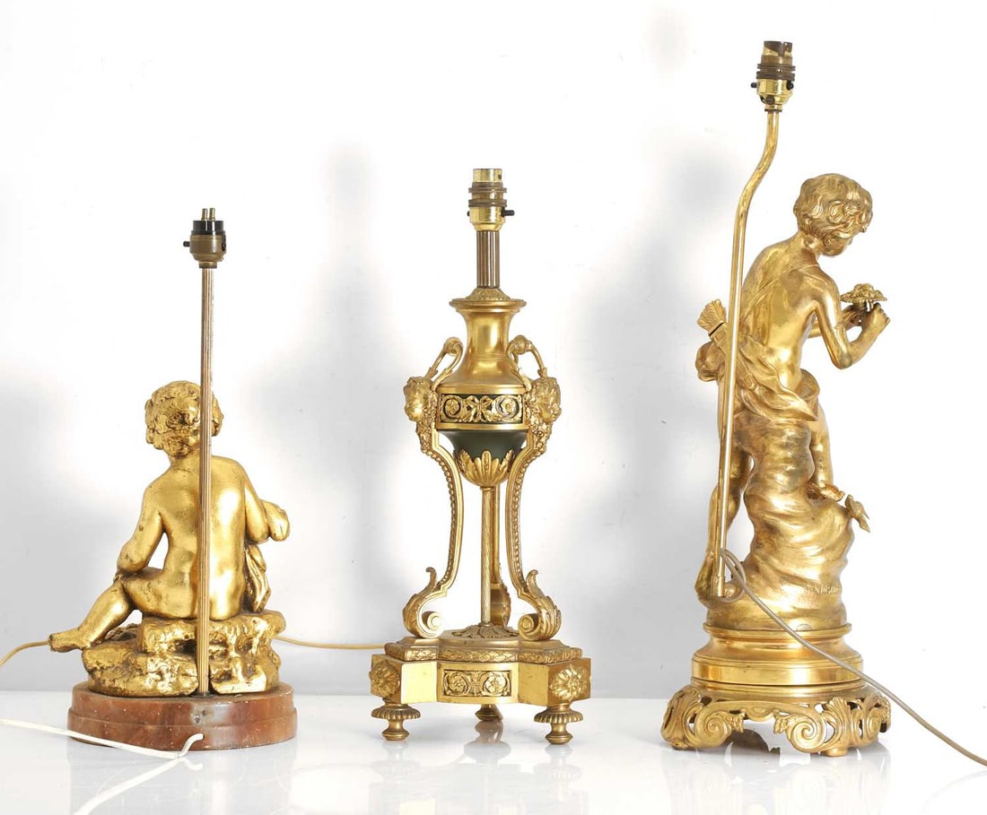 A group of three brass lamps, - 4