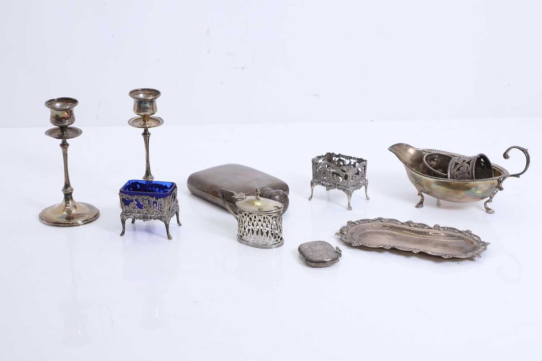 A collection of silver items,: A collection of silver items, to include a pair of candlesticks, by James Dixon & Sons Ltd, Sheffield 1906, each with circular spreading foot rising to a slender baluster stem and waisted socket w