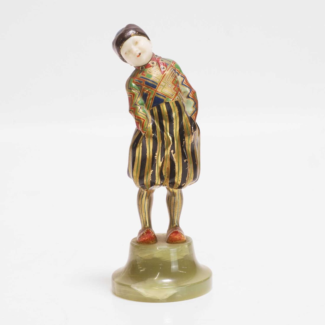 Attributed to Theodor Ullmann (Austrian, 1903-1996), a figure of a boy,: Attributed to Theodor Ullmann (Austrian, 1903-1996), a figure of a boy, circa 1915-20, bronze, polychrome painted and gilt, the head made of carved ivory and polychrome painted, mounted on an onyx bas