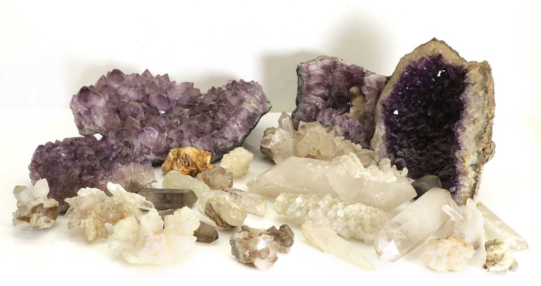 A collection of quartz crystal wands: A collection of quartz crystal wands with a variety of inclusions, together with a group of large quartz fragments largest 40cm wide qty.