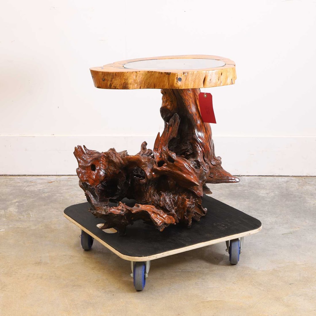Lisa Culley (Contemporary) A large glass top root table,: Lisa Culley (Contemporary) A large glass top root table, the inset top raised on spoked support 50cm wide, 31cm deep, 58cm high