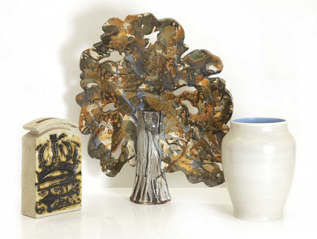 A collection of studio pottery, 20th century,: A collection of studio pottery, 20th century, comprising a studio pottery relief vase of arched rectangular form, moulded in relief with stylised foliate and geometric ornament with brown and black ac