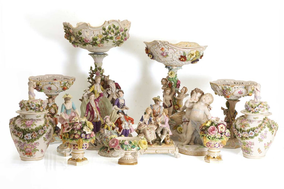 A collection of continental porcelain, late 19th / early 20th century,: A collection of continental porcelain, late 19th / early 20th century, mostly German, to include Dresden and Von Schierholz, comprising figures, vases, and tazzas, a large centerpeiece modelled as a