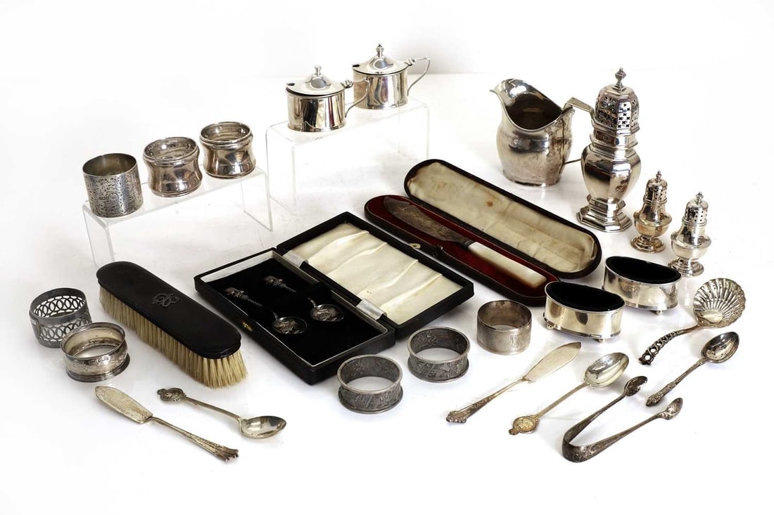A collection of silver,: A collection of silver, comprising, a four-piece condiment set, Atkin Bros, Birmingham, a silver castor, London, 1904, a silver snuff box, by Henry Charles Freeman, Birmingham, 1898, a pair of peppere