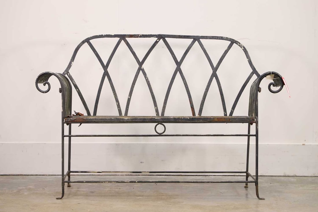 A painted wrought iron style bench, 20th century,: A painted wrought iron style bench, 20th century, with scrolled arms and crossed back 138cm wide, 47cm deep, 92cm high
