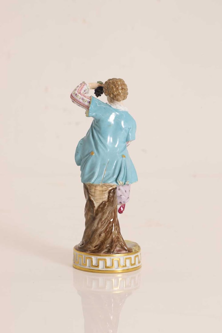A Meissen porcelain figure of a grape seller, 19th century, - 2