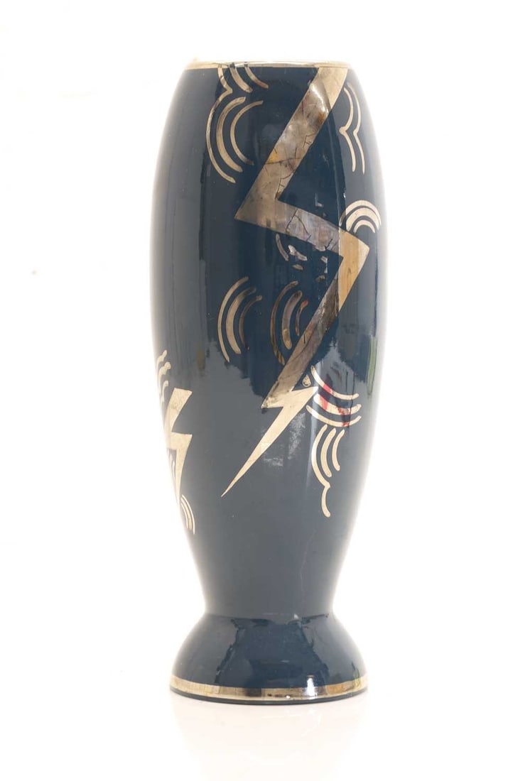 An Art Deco-style ceramic vase,: An Art Deco-style ceramic vase, of tapering baluster form with flared foot, decorated with silvered lightening bolts and geometric motifs against a teal blue ground 28.5cm high
