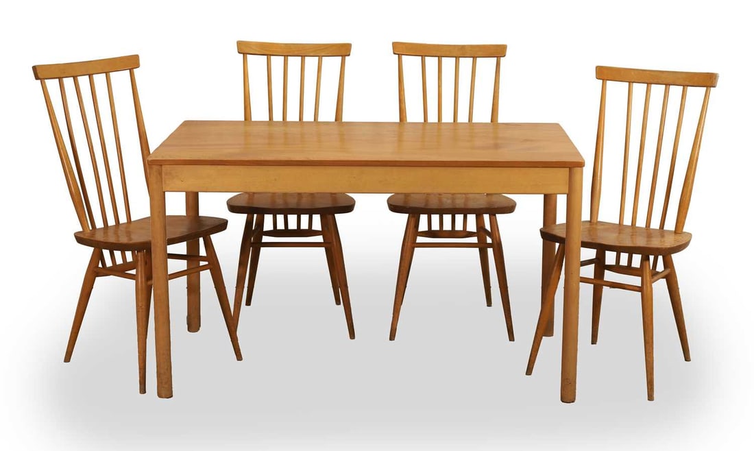 An Ercol blonde elm dining suite, 20th century,: An Ercol blonde elm dining suite, 20th century, to include a dining table and four chairs, all pieces with labels to the undersides Table, 122cm wide, 69cm deep, 72cm high, chairs, 42cm wide, 52cm dee