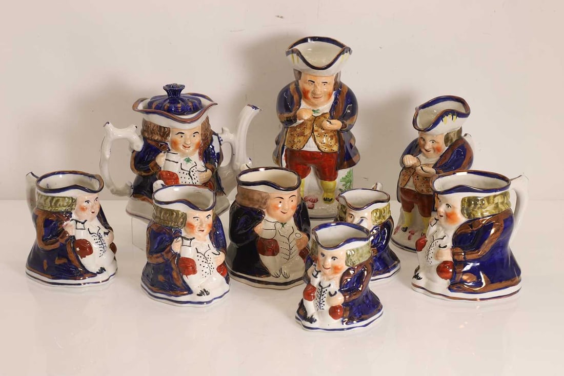 A collection of Allertons Toby jugs, 19th century,: A collection of Allertons Toby jugs, 19th century, of various scales together with a teapot and cover the largest 24cm hgh