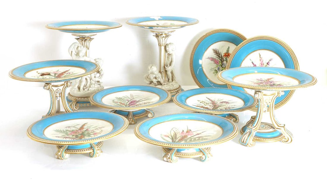 A collection of Royal Worcester plates and comports, late 19th century,: A collection of Royal Worcester plates and comports, late 19th century, comprising, a pair of tall comports, each modelled with putti, a small pair of comports and four further lower comports, and