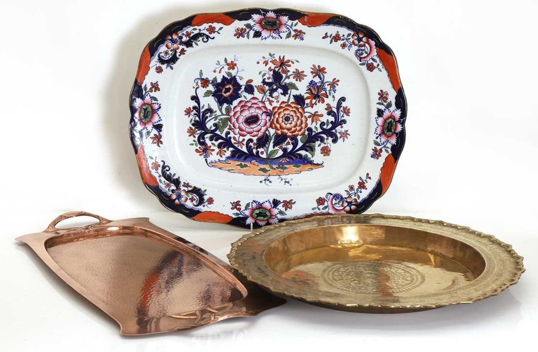 Art Nouveau copper tray, circa 1900: Art Nouveau copper tray, circa 1900 of rectangular form with planished decoration, together with an Indian brass circular tray with a shaped rim and elephant motif to the center, and a granite stone