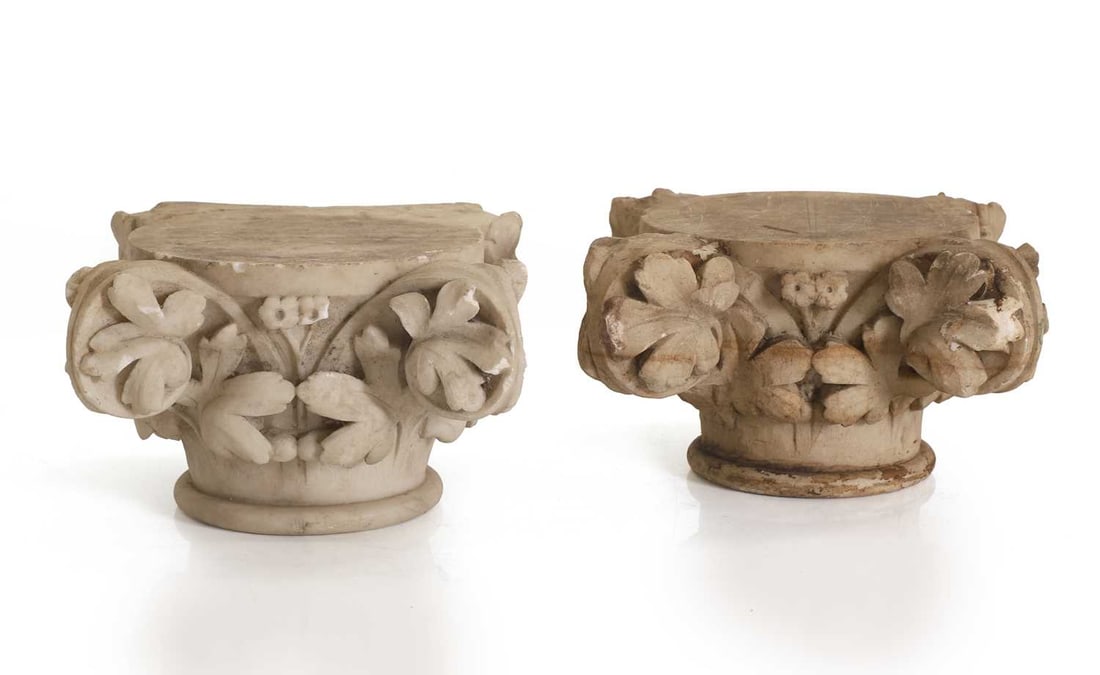 Two marble capitals, late 18th to early 19th century,: Two marble capitals, late 18th to early 19th century, probably Italian, of compressed Corinthian inspired form, carved in relief with acanthus foliage and scrolling voluts beneath a circular abacus,