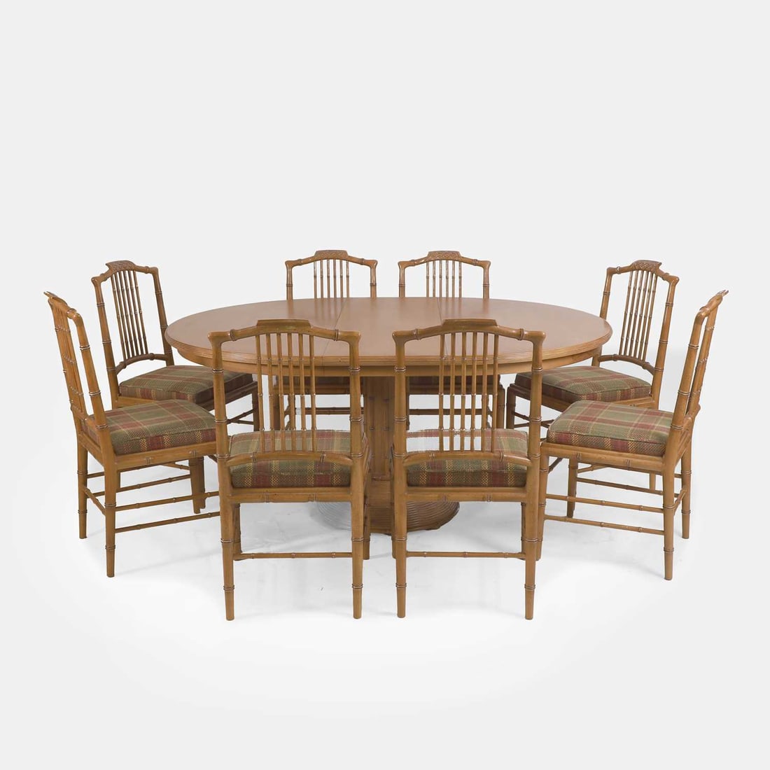Giorgetti, a maple dining suite,: Giorgetti, a maple dining suite, circa 1970s, comprising: a round-top extending dining table, raised on a central column over a graduated circular base, together with eight matching dining chairs, eac