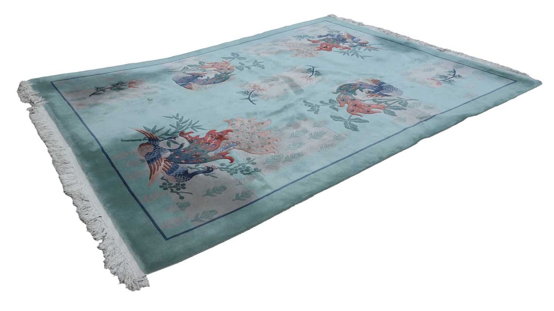 A green ground Chinese super wash carpet, 20th century,: A green ground Chinese super wash carpet, 20th century, with pale green ground decorated with resplendent peacocks and exotic birds, amongst leaf motifs and foliage approx 370 x 270cm