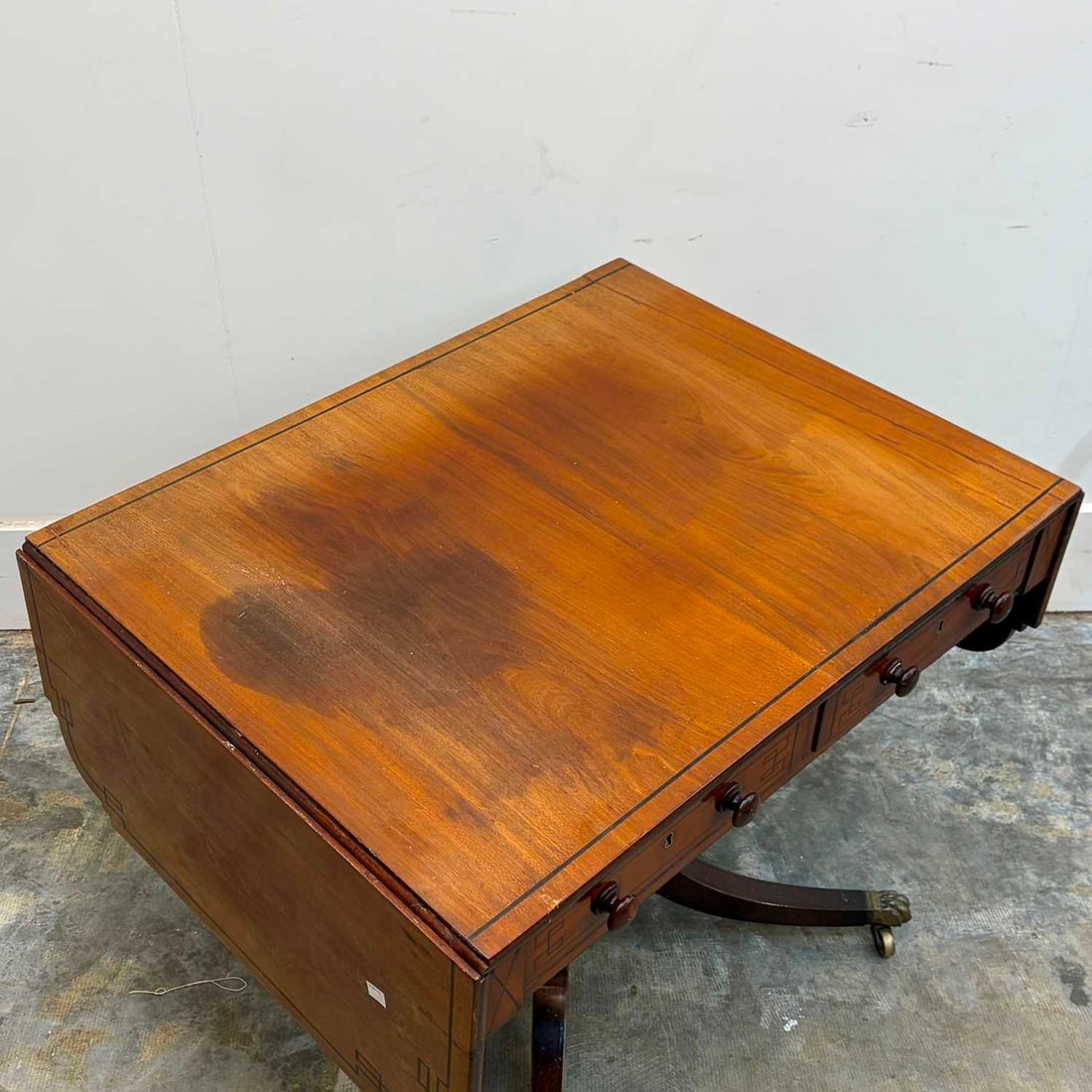 A late Regency mahogany and ebony sofa table, 19th century, - 2