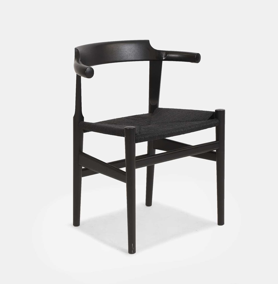 Hans J Wegner (Danish, 1914-2007), a model 'PP68' chair,: Hans J Wegner (Danish, 1914-2007), a model 'PP68' chair, designed in 1987, the ebonised steam-bent oak frame with a curved back, a black papercord seat, and raised on four tapering legs 60cm wide, 43c