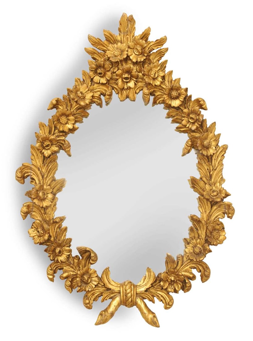 A French gilt wood mirror, 20th century,: A French gilt wood mirror, 20th century, of shaped oval form, moulded with flowering foliage and scrolling acanthus leaves, surmounted by foliate ornament and ribbon tied foliate decoration the base