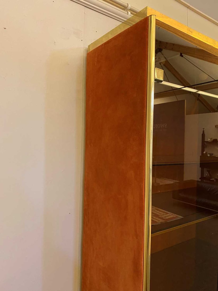Manner of Renato Zevi, a brass and orange suede wall cabinet, - 11